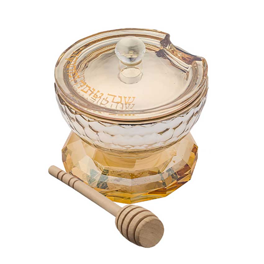 Donnez des allures de fête à votre table avec ce ravissant Petit pot à miel en cristal ambré et sa cuillère en bois. Un pot où vous pourrez y verser votre miel pour que l'année à venir soit douce.