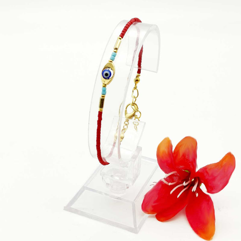 Ce joli Bracelet Petites Perles contre le Mauvais Oeil de couleur Rouge à l'allure estivale saura vous séduire par sa simplicité.